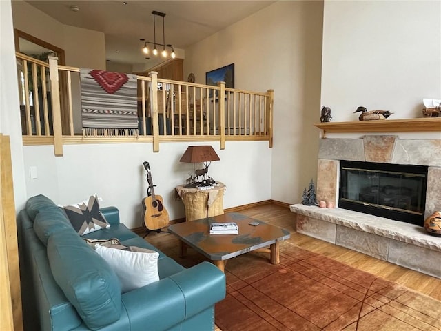 2300 Apres Ski Way Unit 12, Steamboat Springs, CO 80487 - living area featuring wood finished floors, a glass covered fireplace, and baseboards