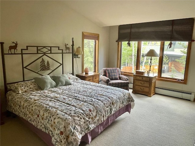 2300 Apres Ski Way Unit 12, Steamboat Springs, CO 80487 - bedroom featuring light carpet, vaulted ceiling, and baseboard heating