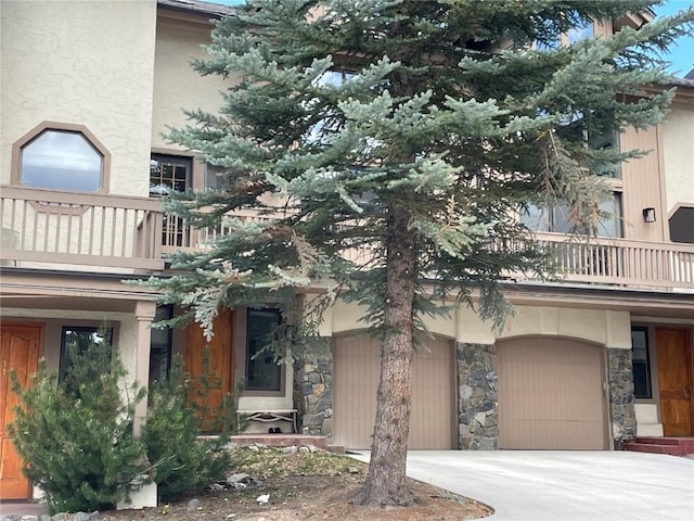2300 Apres Ski Way Unit 12, Steamboat Springs, CO 80487 - view of building exterior featuring concrete driveway and an attached garage