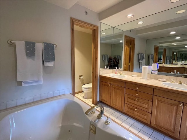 2300 Apres Ski Way Unit 12, Steamboat Springs, CO 80487 - full bathroom featuring toilet, a tub with jets, recessed lighting, tile patterned floors, and double vanity