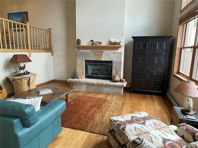 2300 Apres Ski Way Unit 12, Steamboat Springs, CO 80487 - living room with wood finished floors, a glass covered fireplace, and baseboards