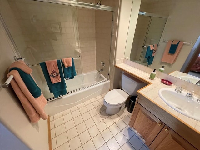 2300 Apres Ski Way Unit 12, Steamboat Springs, CO 80487 - full bath featuring tile patterned floors, enclosed tub / shower combo, toilet, and vanity