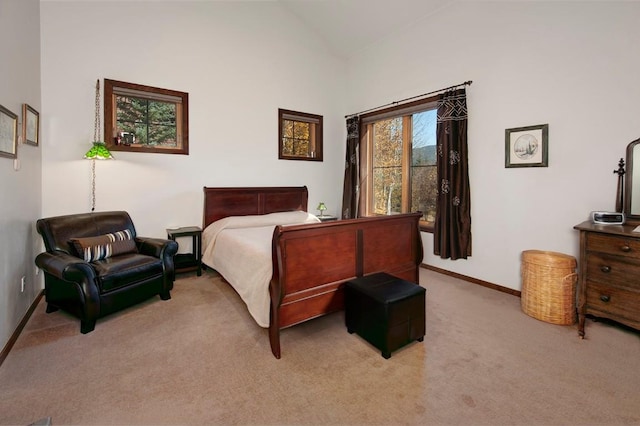 27 Habitat Ct, Dillon, CO 80435 - bedroom featuring lofted ceiling, light carpet, and baseboards