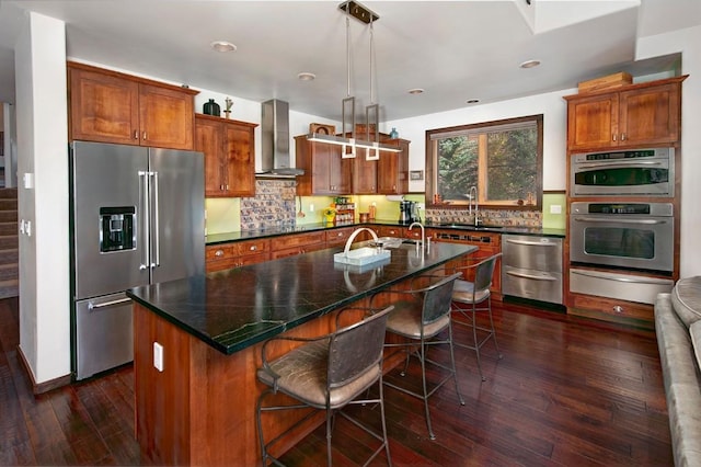 27 Habitat Ct, Dillon, CO 80435 - kitchen featuring stainless steel appliances, wall chimney exhaust hood, a warming drawer, a sink, and dark wood-style floors