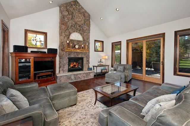 27 Habitat Ct, Dillon, CO 80435 - living room featuring high vaulted ceiling, wood finished floors, a stone fireplace, and recessed lighting