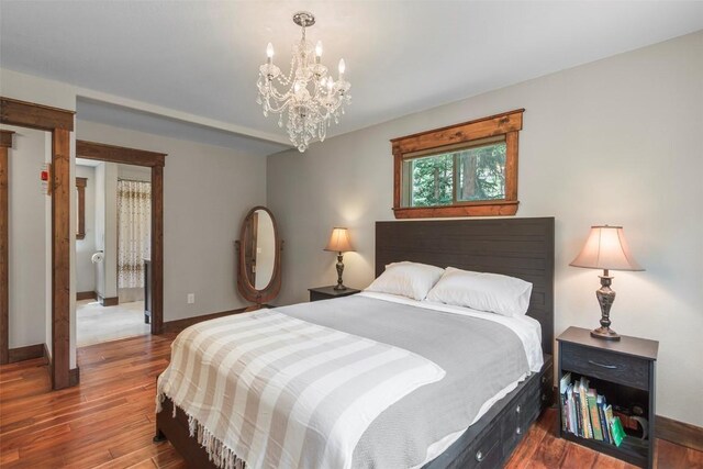 554 Lakeview Dr, Breckenridge, CO 80424 - bedroom with a chandelier, baseboards, and wood finished floors