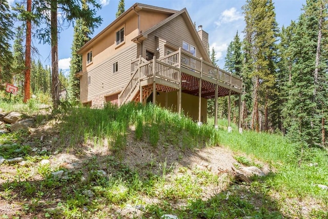 554 Lakeview Dr, Breckenridge, CO 80424 - rear view of house with a deck, a chimney, and stairway