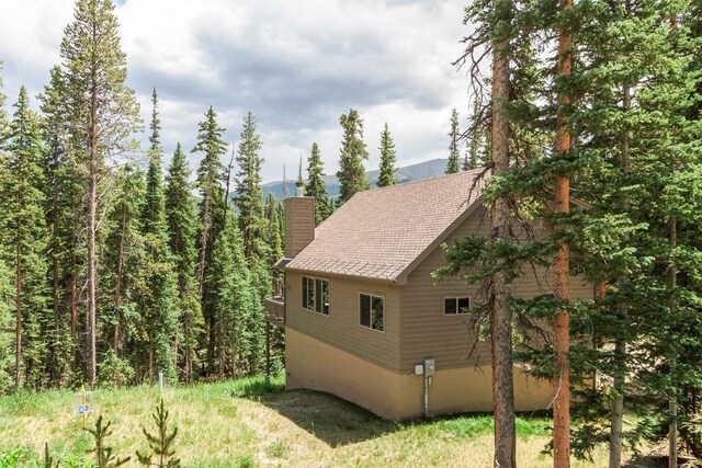 554 Lakeview Dr, Breckenridge, CO 80424 - view of side of property featuring a chimney