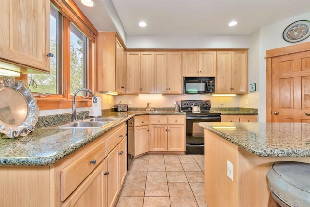 1250 Harwig Cir, Steamboat Springs, CO 80487 - kitchen with black appliances, light brown cabinetry, a sink, and recessed lighting