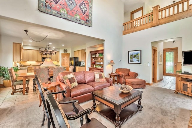 1250 Harwig Cir, Steamboat Springs, CO 80487 - living room with light carpet, light tile patterned flooring, a towering ceiling, a chandelier, and baseboards