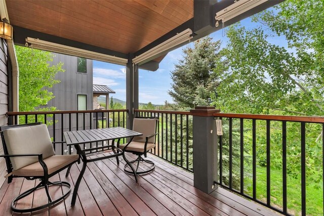 1250 Harwig Cir, Steamboat Springs, CO 80487 - wooden deck featuring outdoor dining area