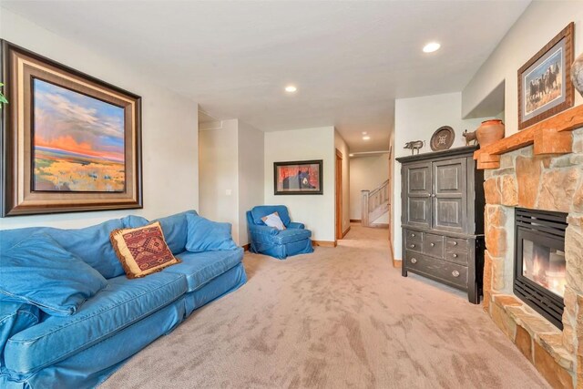 1250 Harwig Cir, Steamboat Springs, CO 80487 - carpeted living area with a stone fireplace, recessed lighting, baseboards, and stairs