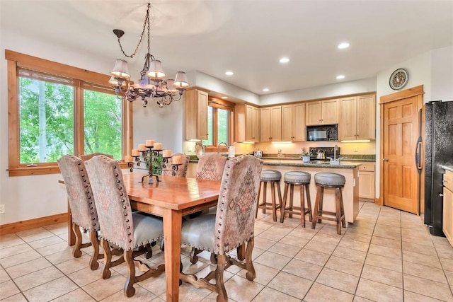1250 Harwig Cir, Steamboat Springs, CO 80487 - dining room featuring light tile patterned floors, a chandelier, recessed lighting, and baseboards