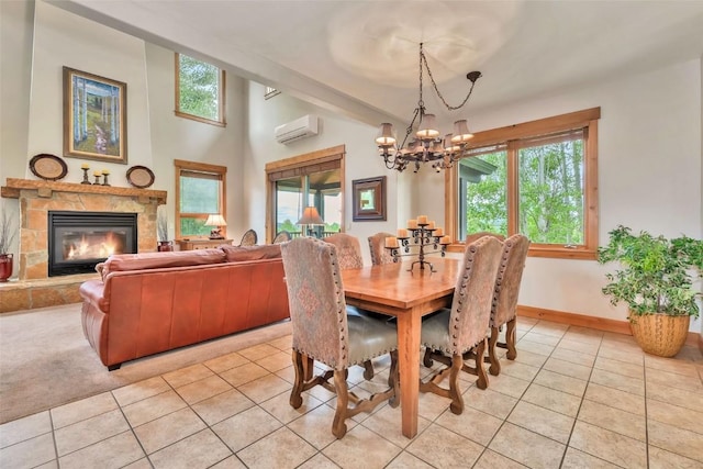 1250 Harwig Cir, Steamboat Springs, CO 80487 - dining room with light tile patterned flooring, a chandelier, a wall mounted air conditioner, a fireplace, and baseboards