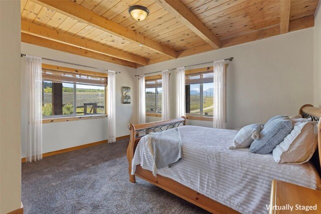 380 Darby Dr, Silverthorne, CO 80498 - bedroom with wood ceiling, baseboards, carpet floors, and beamed ceiling