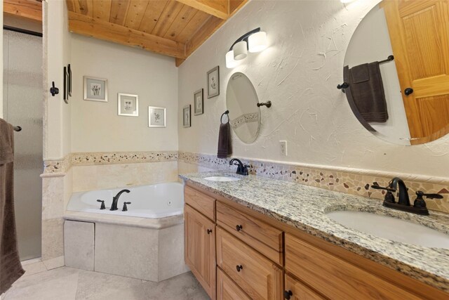 380 Darby Dr, Silverthorne, CO 80498 - full bath featuring wood ceiling, tile patterned flooring, a sink, and a jetted tub