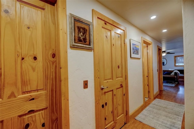 hallway featuring recessed lighting and wood finished floors