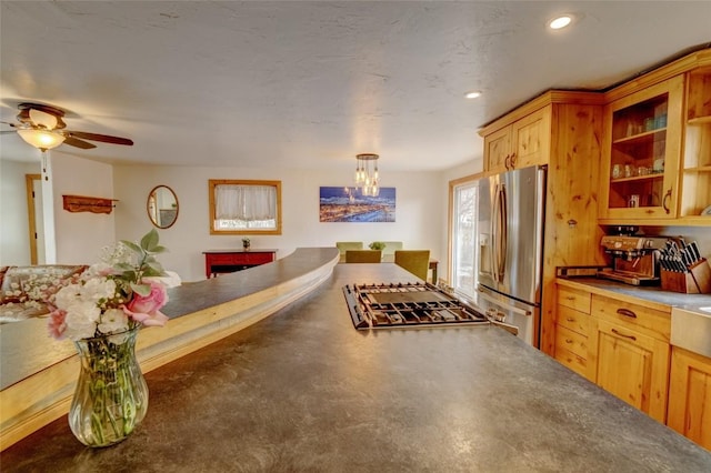 kitchen with ceiling fan with notable chandelier, stainless steel appliances, recessed lighting, and decorative light fixtures