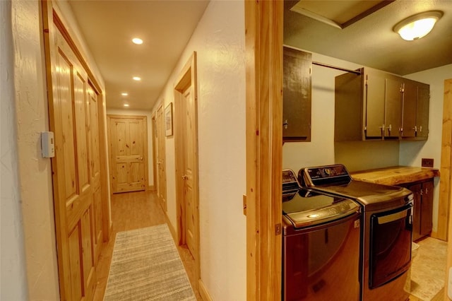 laundry area with recessed lighting, cabinet space, and washer and clothes dryer