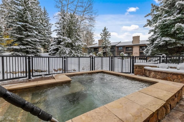 view of pool with a fenced backyard