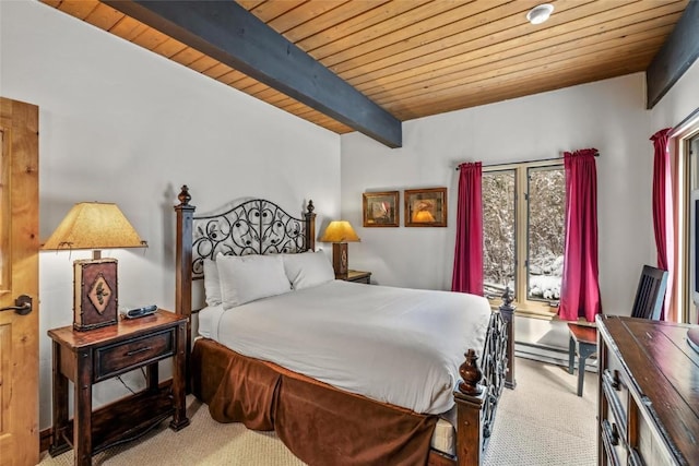bedroom with beamed ceiling, a baseboard radiator, carpet flooring, and wooden ceiling