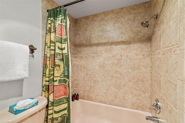 bathroom with shower / bath combo with shower curtain and toilet