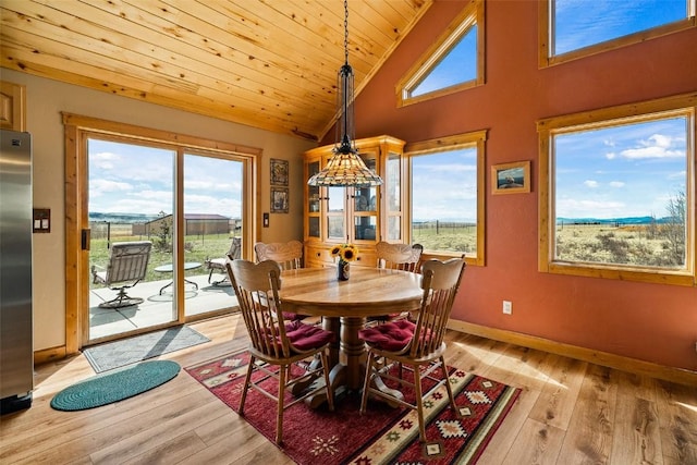 188 June Grass Ct, Fairplay, CO 80440 - dining space with healthy amount of natural light, light wood finished floors, wood ceiling, and high vaulted ceiling