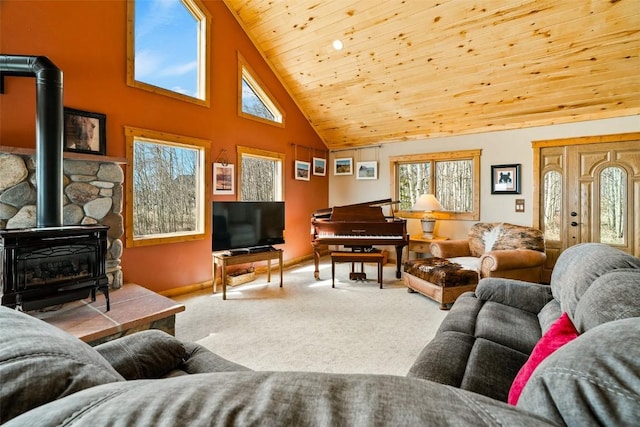 188 June Grass Ct, Fairplay, CO 80440 - living area with a wood stove, carpet flooring, high vaulted ceiling, healthy amount of natural light, and wooden ceiling