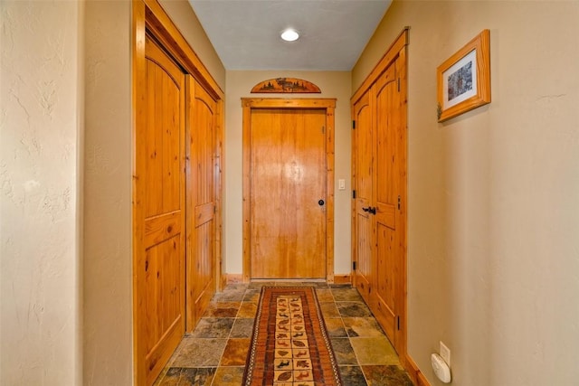 188 June Grass Ct, Fairplay, CO 80440 - hallway featuring stone tile floors and baseboards