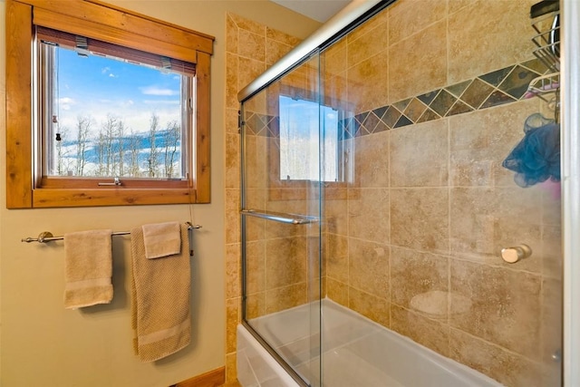 188 June Grass Ct, Fairplay, CO 80440 - bathroom featuring bath / shower combo with glass door and plenty of natural light