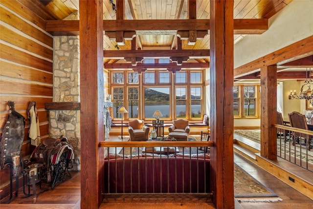 32855 More Ln, Steamboat Springs, CO 80487 - interior space with hardwood / wood-style flooring, a water view, wooden ceiling with exposed beams, and a chandelier