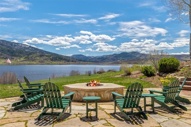 32855 More Ln, Steamboat Springs, CO 80487 - view of patio with an outdoor fire pit and a water and mountain view