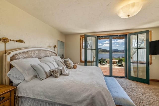 32855 More Ln, Steamboat Springs, CO 80487 - carpeted bedroom with access to exterior and a textured ceiling