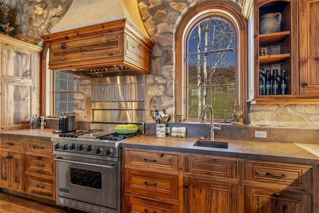 32855 More Ln, Steamboat Springs, CO 80487 - kitchen featuring designer stove, a sink, premium range hood, and brown cabinets