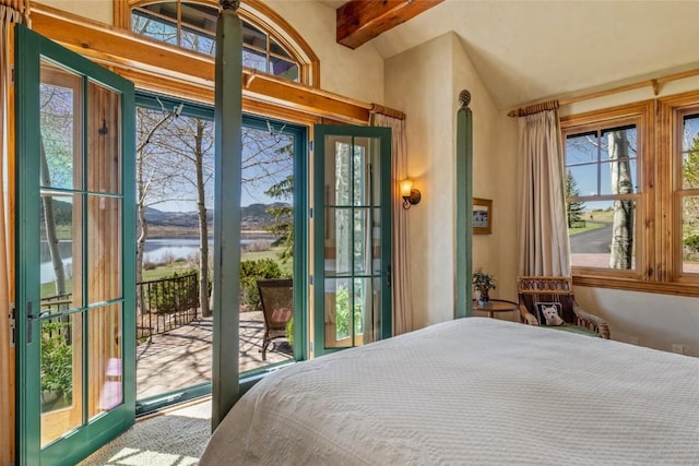 32855 More Ln, Steamboat Springs, CO 80487 - bedroom with a water view, access to exterior, beamed ceiling, multiple windows, and high vaulted ceiling