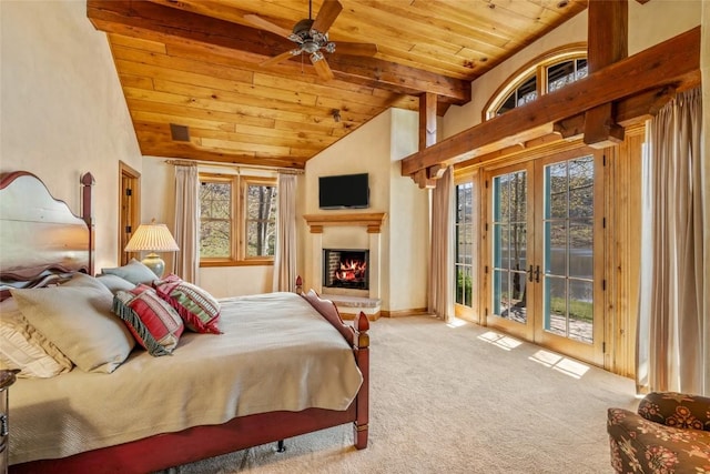 32855 More Ln, Steamboat Springs, CO 80487 - bedroom with french doors, wooden ceiling, carpet flooring, access to outside, and a lit fireplace