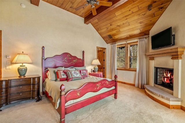 32855 More Ln, Steamboat Springs, CO 80487 - carpeted bedroom featuring wood ceiling, a warm lit fireplace, baseboards, and a ceiling fan
