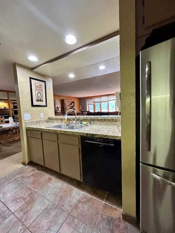 22340 US Highway 6 Unit 1788, Keystone, CO 80435 - kitchen with freestanding refrigerator, black dishwasher, a sink, and recessed lighting