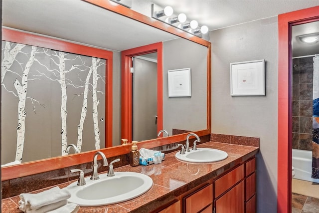 bathroom featuring double vanity and a sink