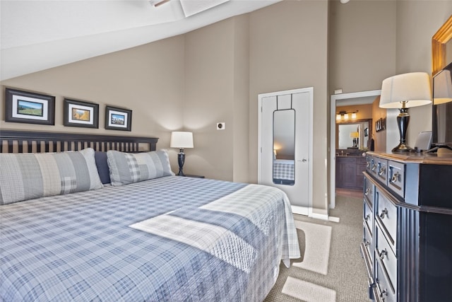 100 S Park Ave Unit E321, Breckenridge, CO 80424 - bedroom featuring light colored carpet, high vaulted ceiling, and connected bathroom