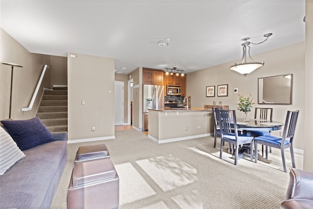 100 S Park Ave Unit E321, Breckenridge, CO 80424 - living room with light colored carpet and stairway