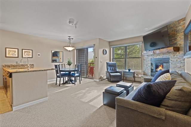 100 S Park Ave Unit E321, Breckenridge, CO 80424 - living area featuring light carpet and a fireplace