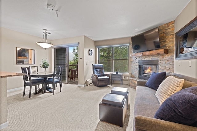 100 S Park Ave Unit E321, Breckenridge, CO 80424 - living room featuring carpet, a fireplace, and a baseboard heating unit