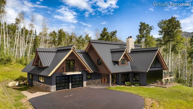 31820 Bradley Rnch, Steamboat Springs, CO 80487 - chalet / cabin with a chimney, driveway, a mountain view, and metal roof
