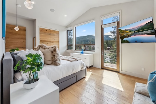 427 Whispering Pines Cir, Blue River, CO 80424 - bedroom featuring access to outside, multiple windows, vaulted ceiling, light wood finished floors, and recessed lighting