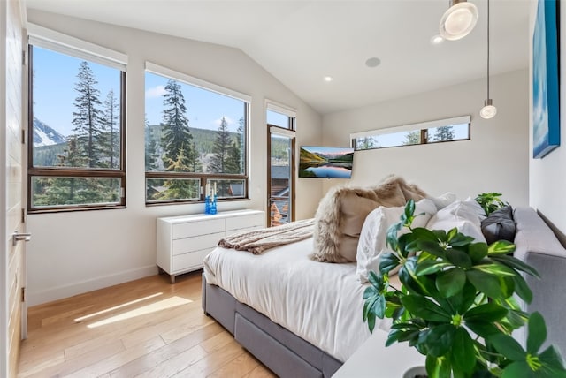 427 Whispering Pines Cir, Blue River, CO 80424 - bedroom featuring vaulted ceiling, light wood finished floors, baseboards, a mountain view, and recessed lighting