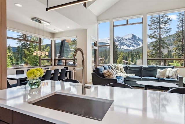 427 Whispering Pines Cir, Blue River, CO 80424 - kitchen featuring a sink, open floor plan, a mountain view, recessed lighting, and light countertops