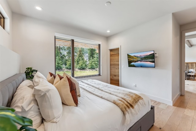 427 Whispering Pines Cir, Blue River, CO 80424 - bedroom with light wood-style floors, recessed lighting, and baseboards