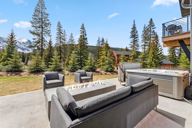 427 Whispering Pines Cir, Blue River, CO 80424 - view of patio with a mountain view, an outdoor living space with a fire pit, and a balcony