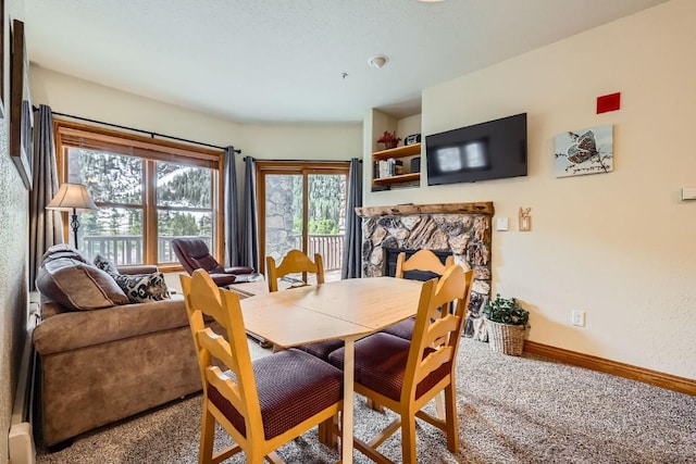 22714 US Highway 6 Unit 5945, Keystone, CO 80435 - dining area featuring carpet and a fireplace